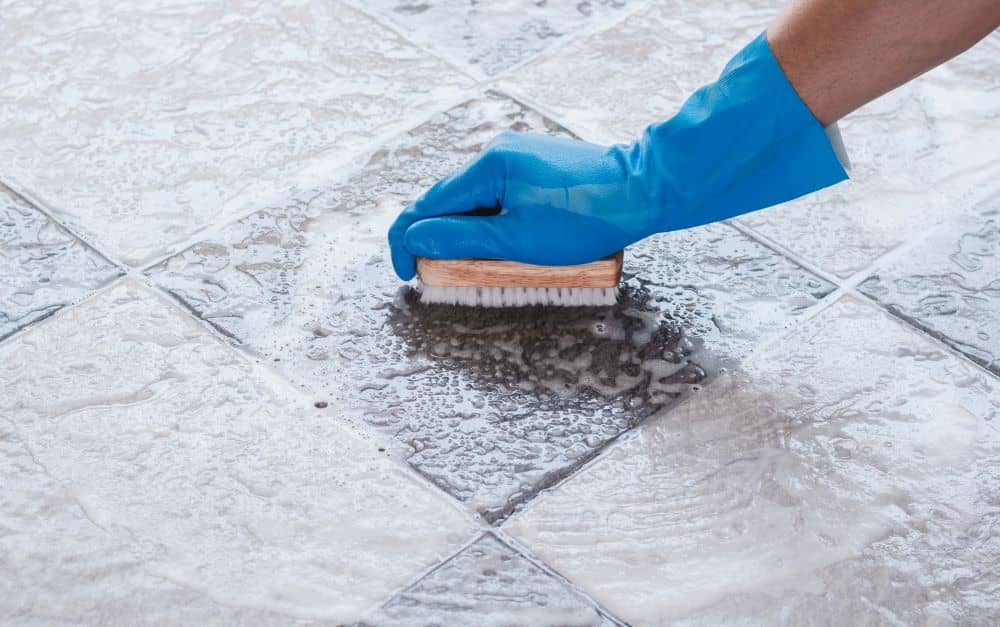 Brushing tile floors — Amazing Carpet Cleaning & Pest Control Services